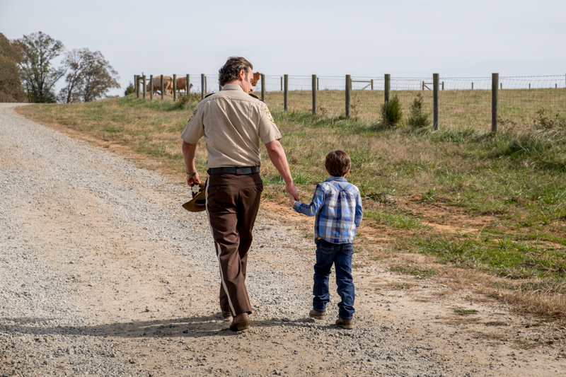 Rick (Andrew Lincoln) and Baby Carl, seen doing a hell of an Andy Griffith and Opie cosplay.